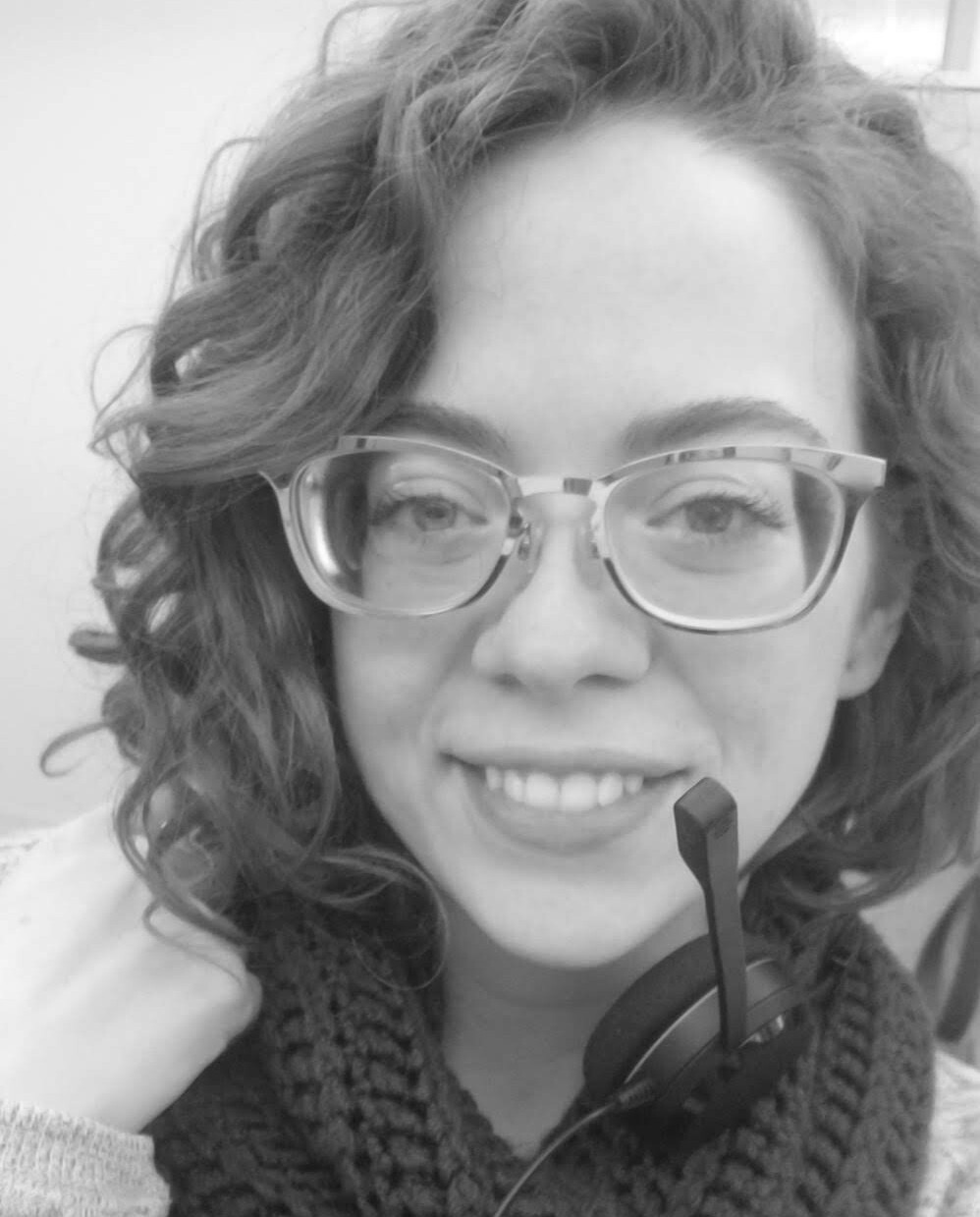 Smiling woman wearing a headset